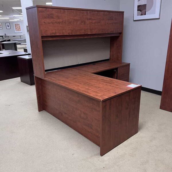 cherry laminate l-desk right return, no pulls, hutch with 4 doors, tan pin board, used