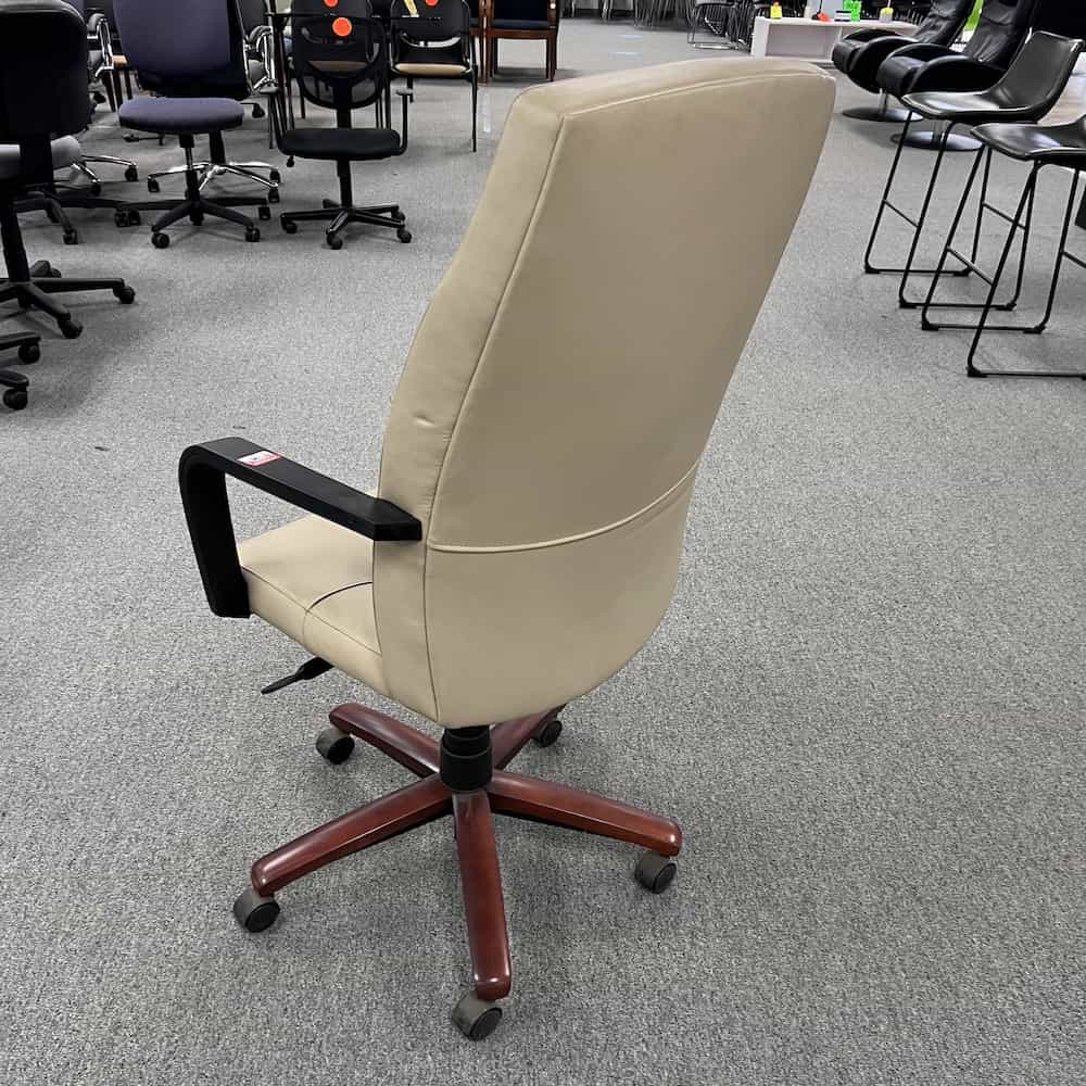 beige gunlock high back executive chair with fixed black arms