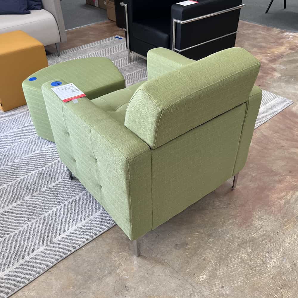 green upholstered lounge arm chair with pentagon shaped ottoman