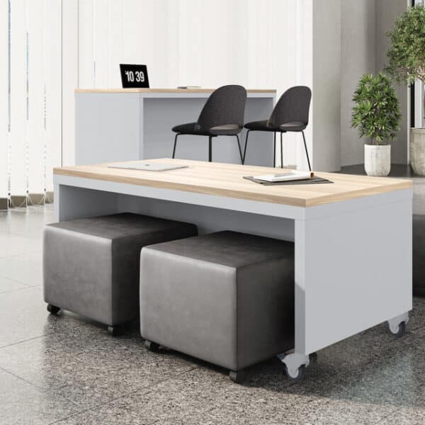 dark grey vinyl square mobile ottoman under a low collaboration table