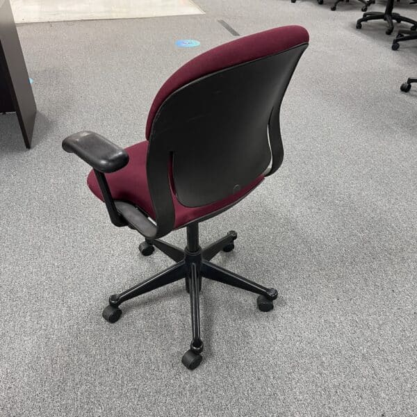 red upholstered herman miller equa chair used