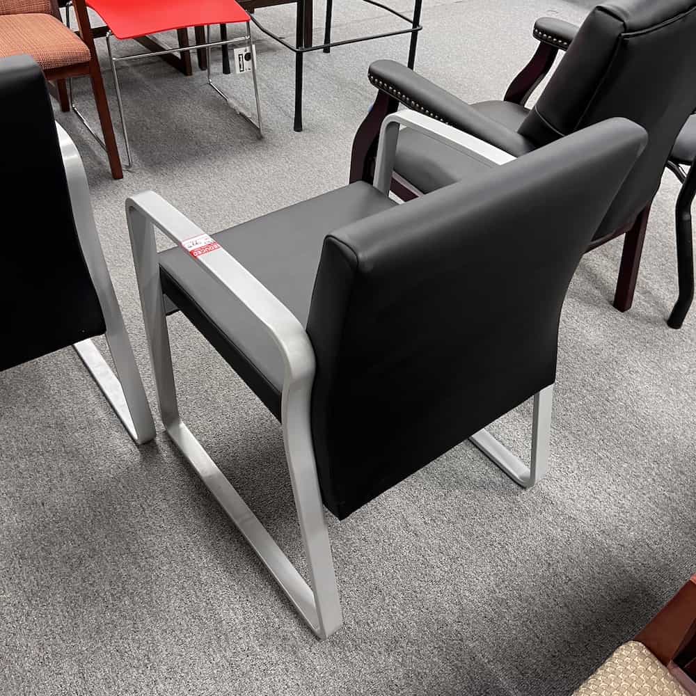 black vinyl guest chair with grey metal legs