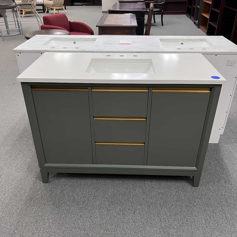 green vanity cabinet with white stone top and gold pulls single sink