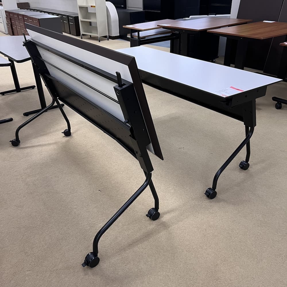 white 66 x 24 laminate folding nesting rolling training table with black base