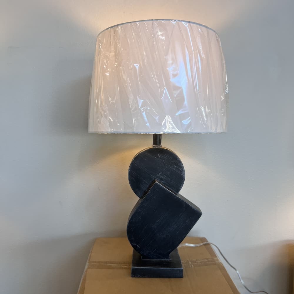 black geometric shapes lamp with white lamp shade