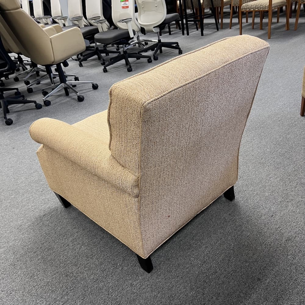 tan upholstered lounge chair