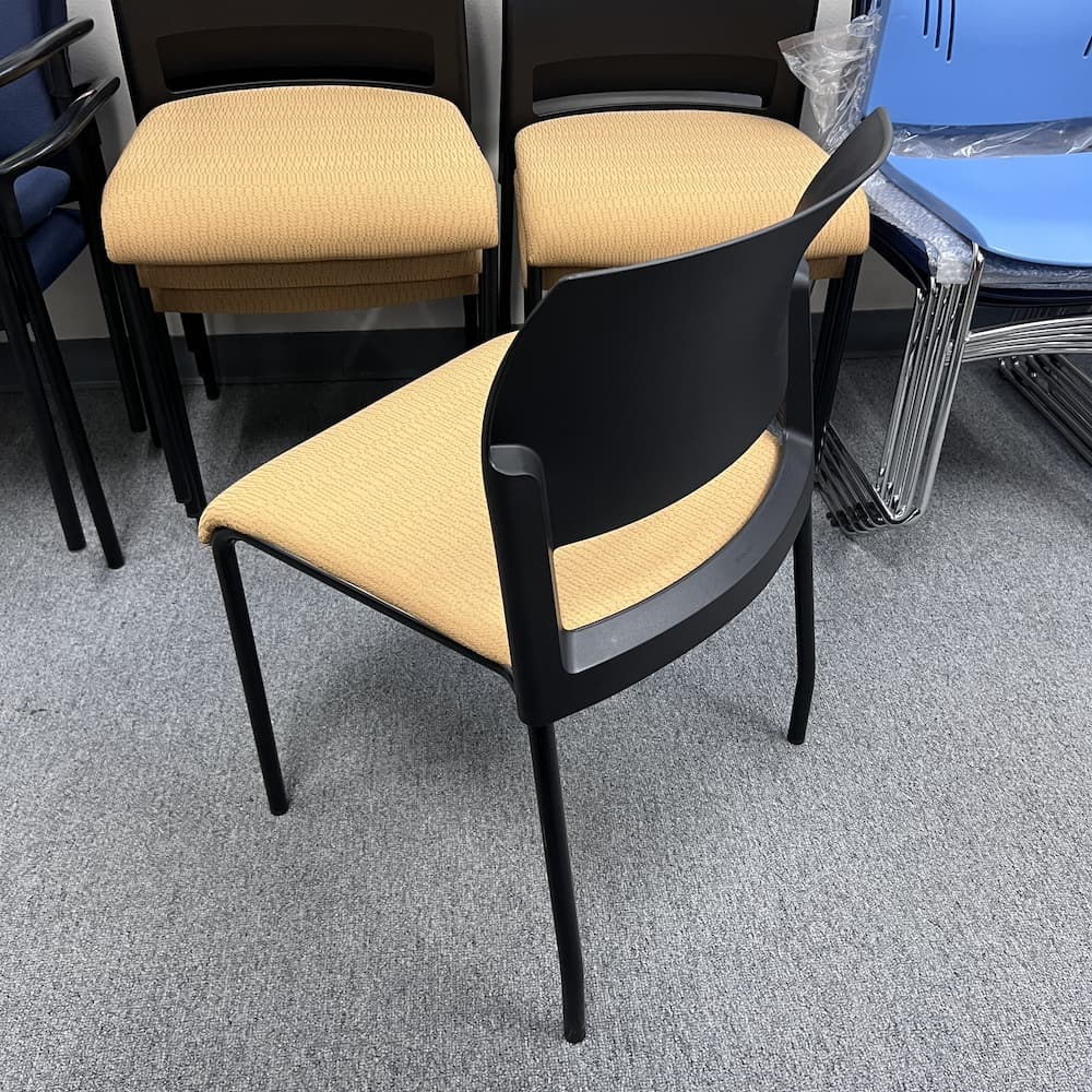 yellow upholstered seat and black plastic back and chair frame steelcase move used furniture office stacking