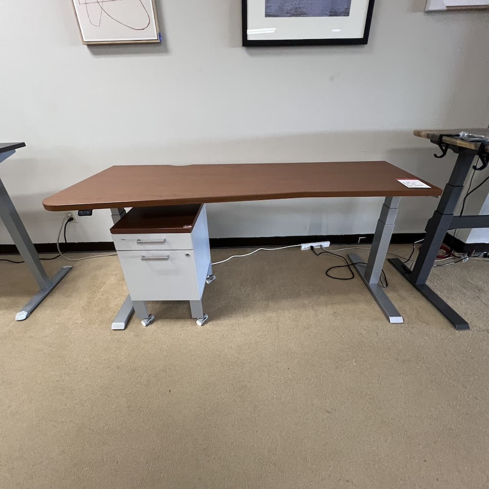 cherry laminate with grey legs standing electric desk by steelcase used in san antonio texas