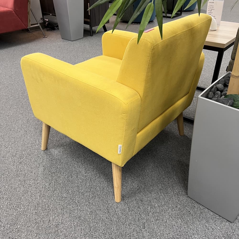 bright yellow upholstered arm chair