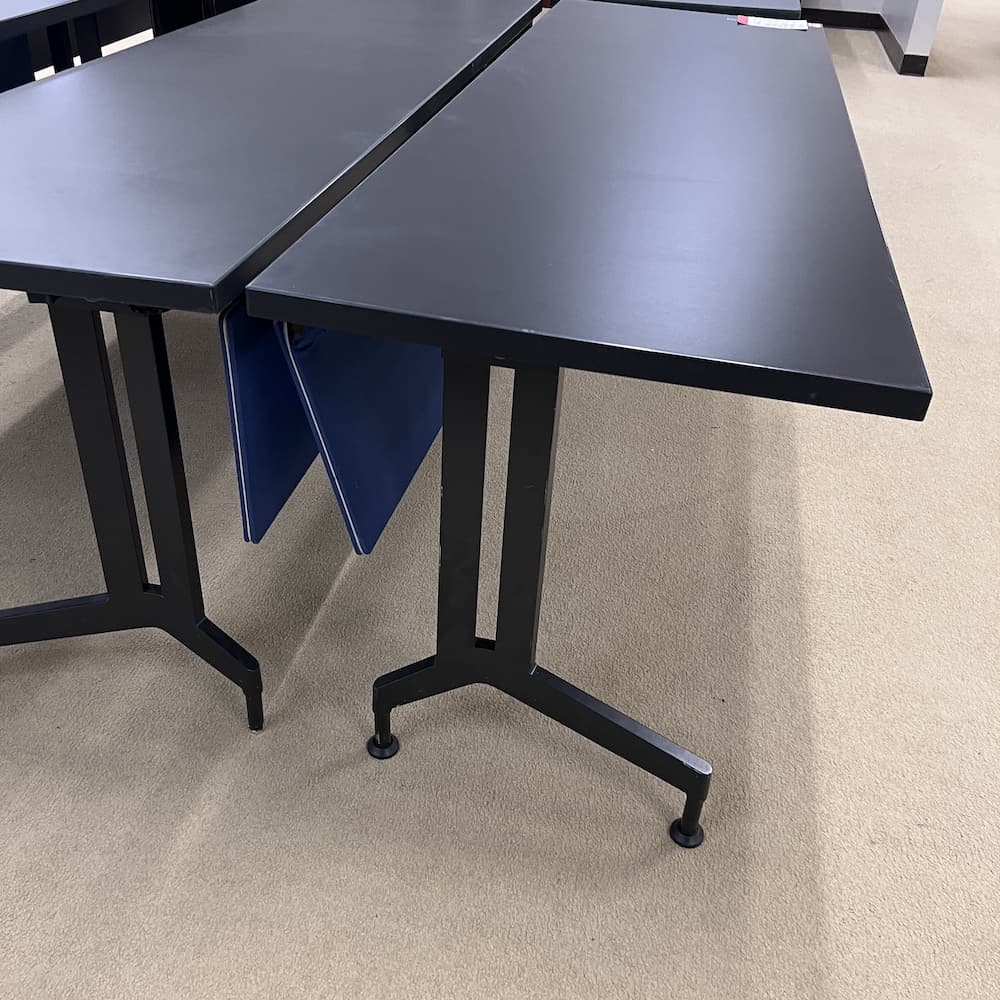 black laminate used training table with blue privacy panels