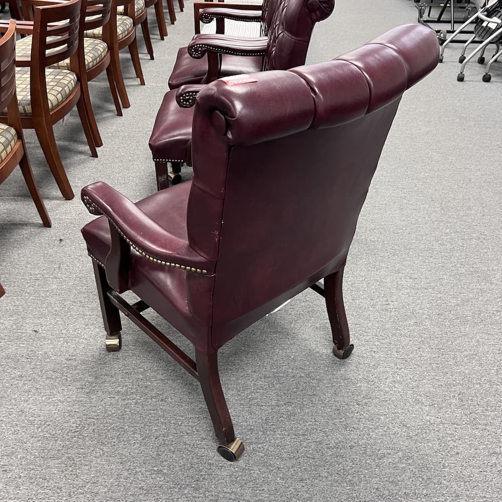 Burgundy vinyl rolling high back guest chair