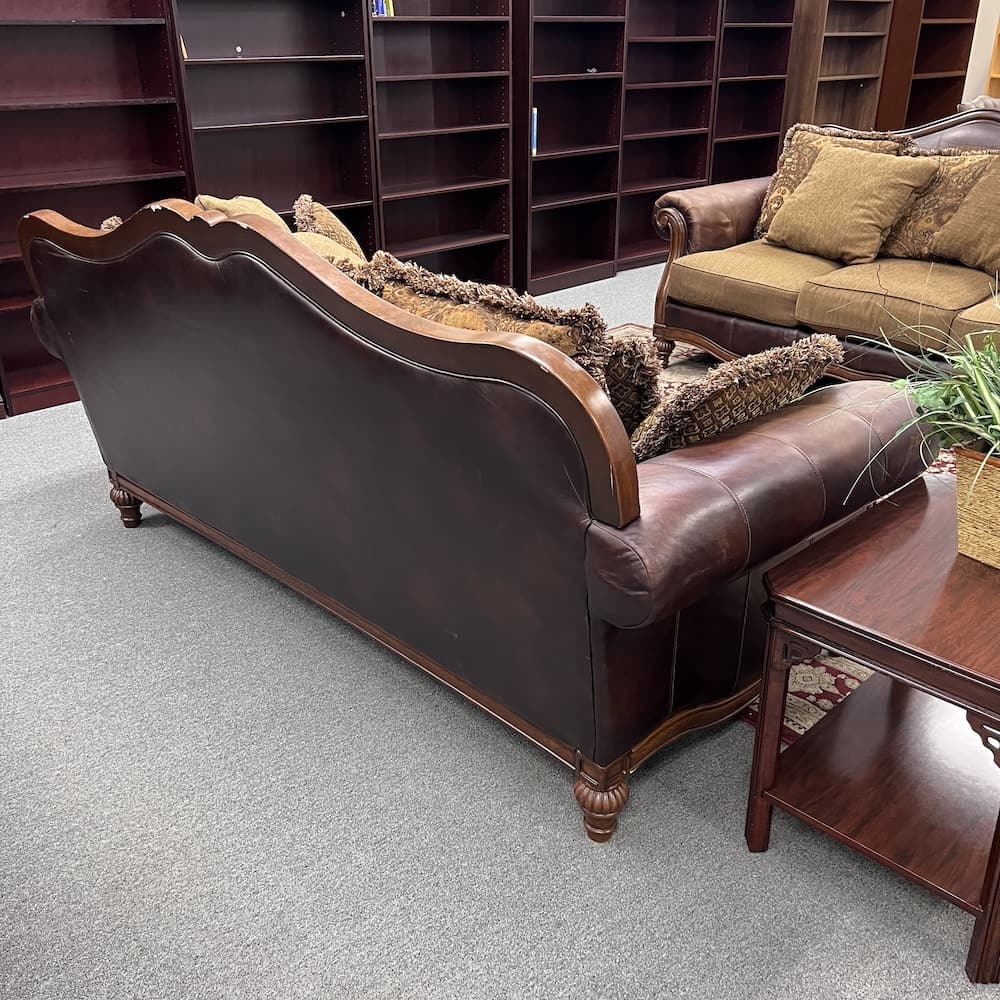 Ashely furniture claremore sofa brown and tan with wood scroll arms and feet used furniture home