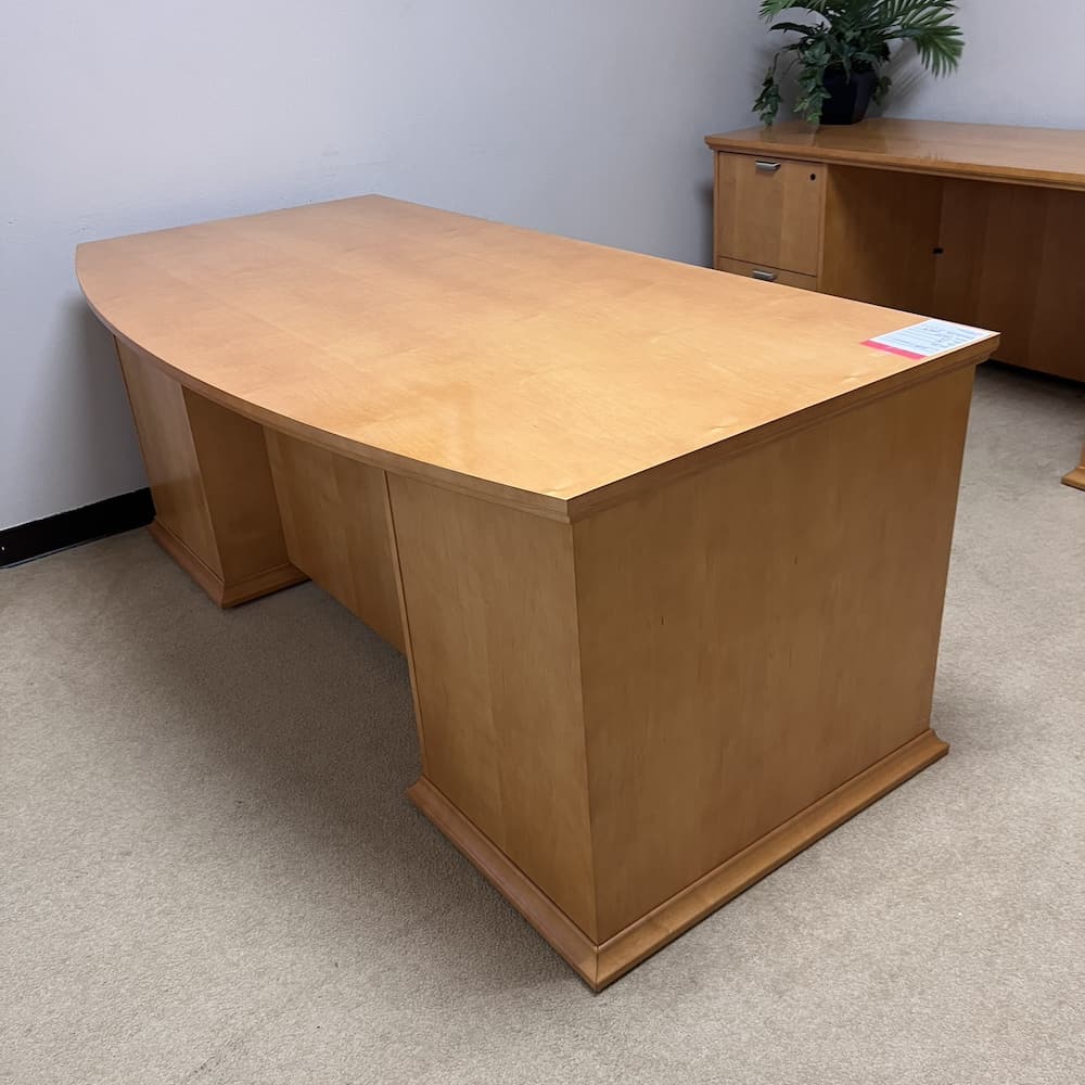 honey veneer bow front desk double pedestal with silver pulls Kimball used office furniture